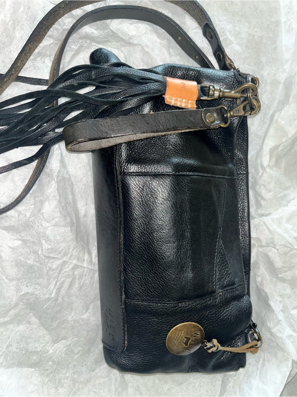 Black Leather Crossbody Bag with Fringe Accent